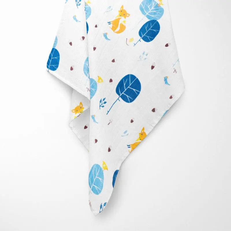 fully opened blue fox bamboo baby blanket displaying Nordic-inspired pattern with blue foxes and abstract forest elements on breathable fabric