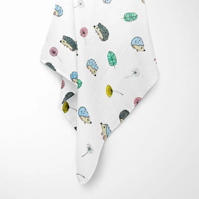 fully opened colorful hedgehog bamboo baby blanket displaying woodland pattern with cute hedgehogs in various colors on breathable organic fabric