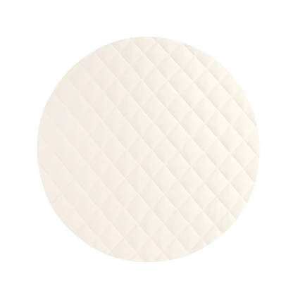 cream round baby play mat with quilted design and premium vegan leather surface