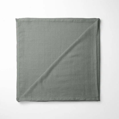 folded dark gray bamboo baby blanket showing neutral color and soft grid texture, suitable for any nursery