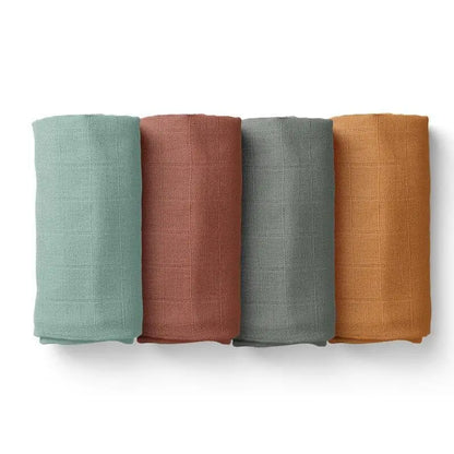 four bamboo baby blanket with soft grid texture rolled, showcasing the natural organic fabric