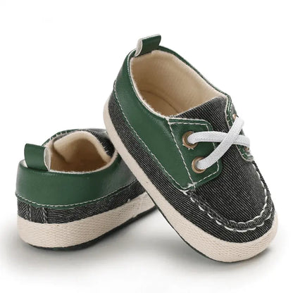 green baby sneakers with brown accent showing soft sole design for 0-18 month babies