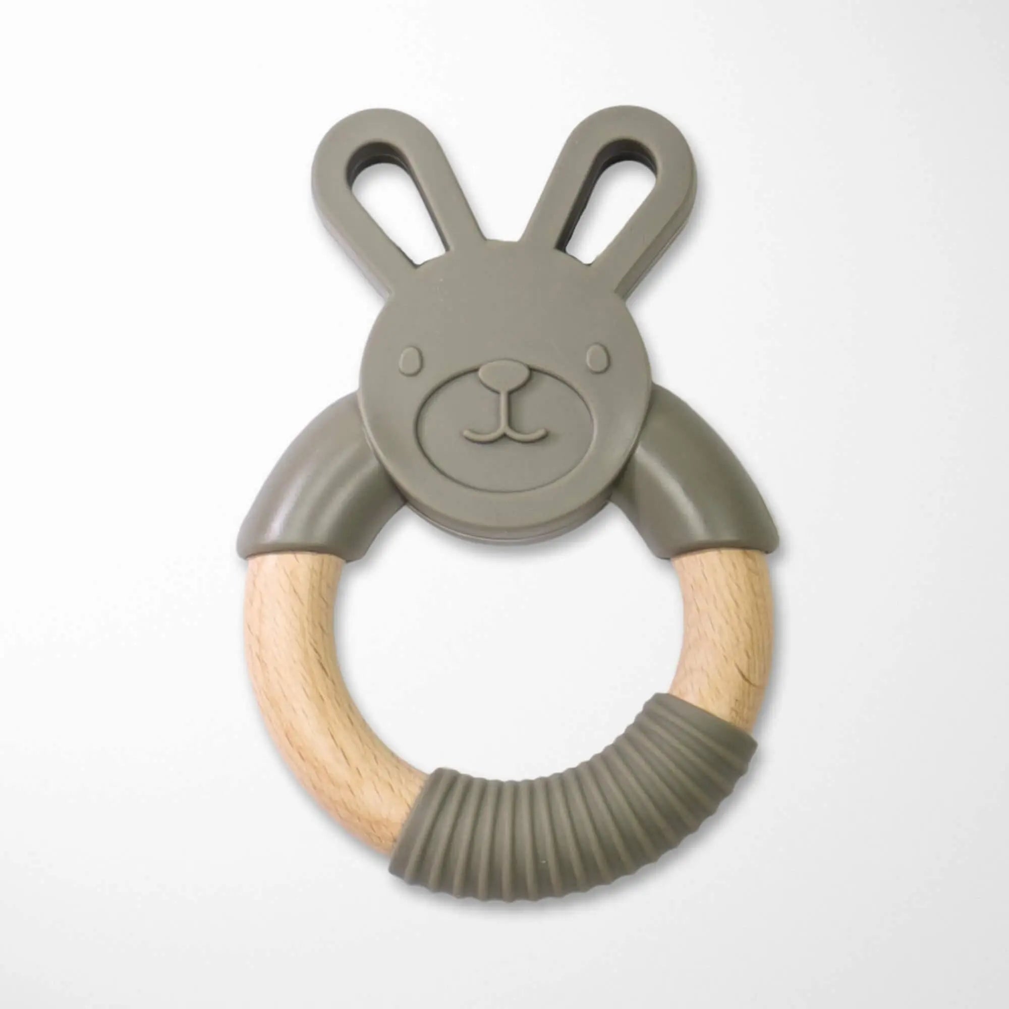 closeup of green bunny silicone wood teether showing textured surface and natural materials