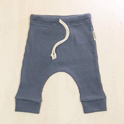indigo blue baby pants in ribbed organic cotton with adjustable drawstring waist and cuffed ankles for perfect fit