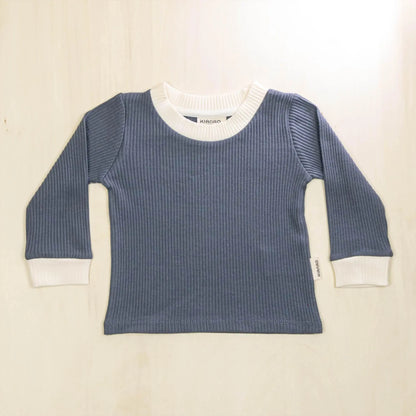 indigo blue organic cotton baby sweater with white contrast collar and cuffs, retro design for comfortable warmth