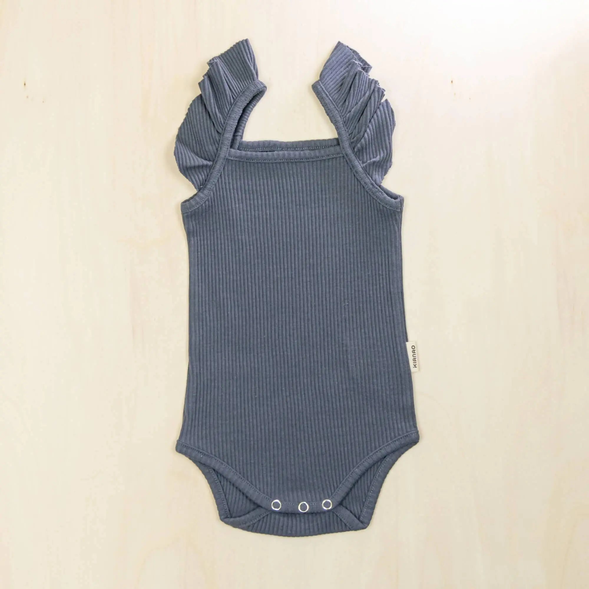 indigo blue flutter sleeve organic cotton baby bodysuit with delicate ruffle detail and soft stretchy fabric