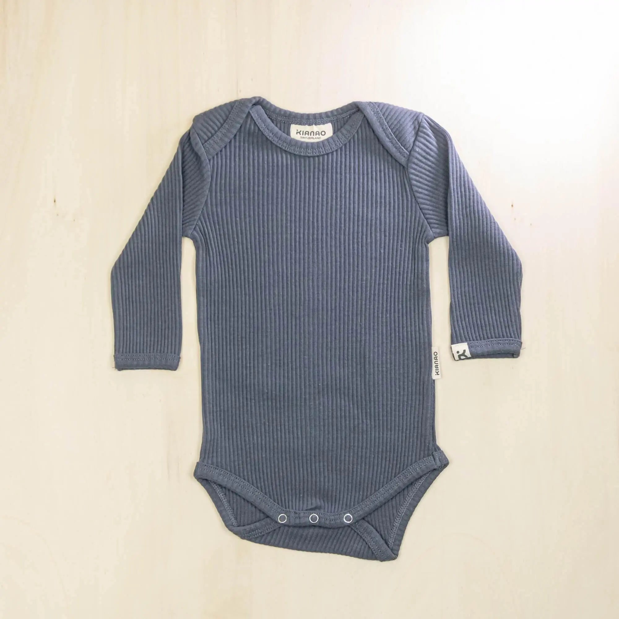 indigo blue long sleeve organic cotton baby bodysuit perfect for layering in all seasons