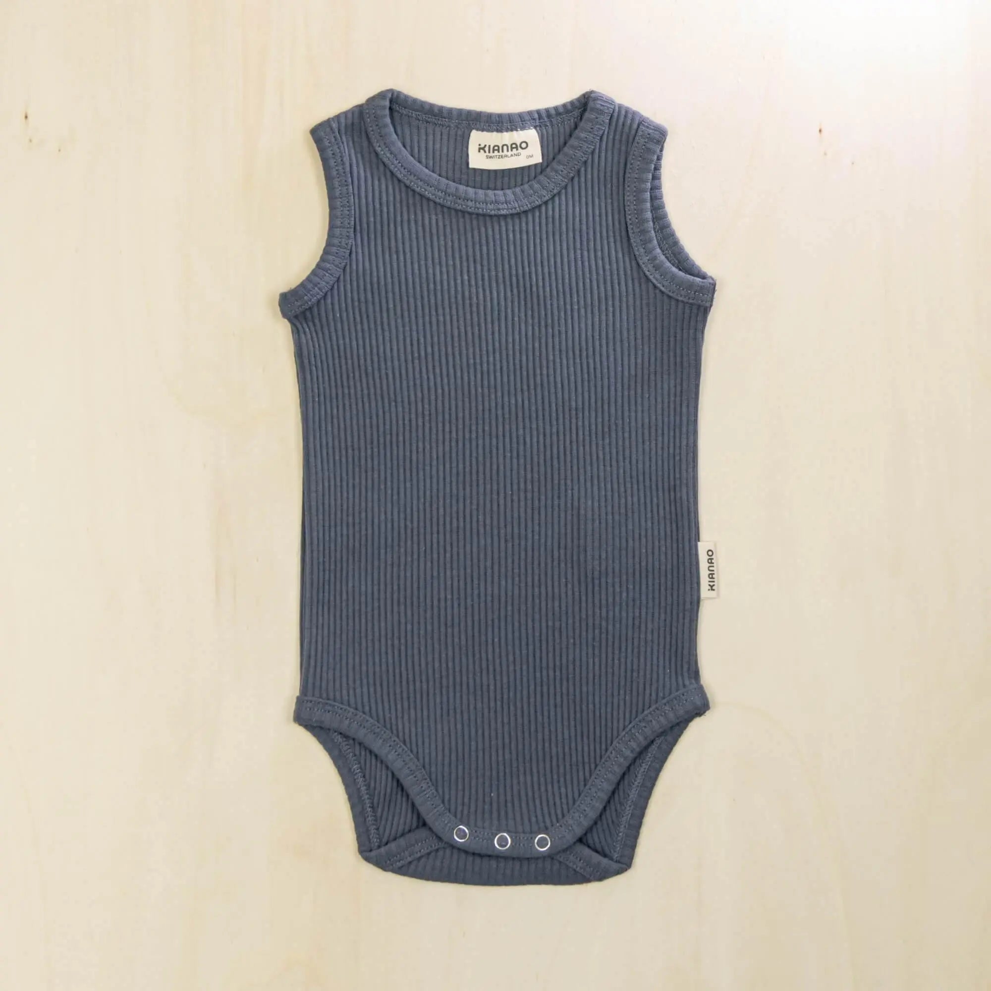 indigo blue organic cotton baby bodysuit sleeveless design with snap closures for easy diaper changes