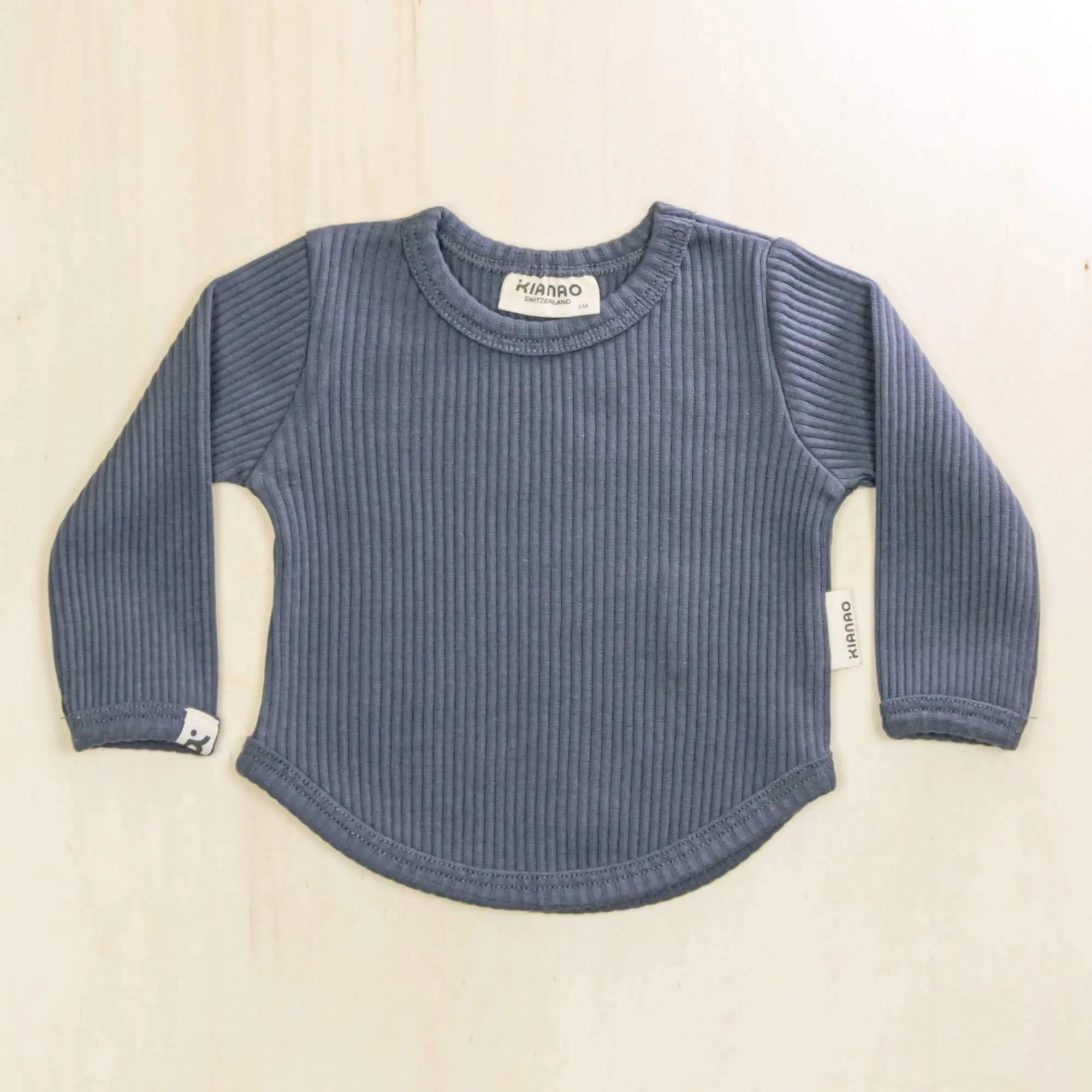 indigo blue organic cotton baby shirt with ribbed texture and long sleeves, gentle on sensitive skin