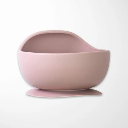 light pink silicone baby bowl with secure suction base, BPA-free construction and perfect size for infant feeding