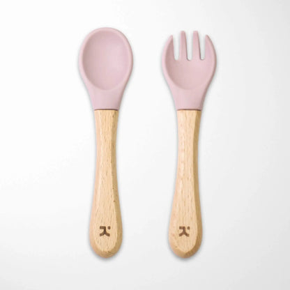 light pink silicone-tipped bamboo baby spoon and fork set with sustainable wooden handles for eco-conscious feeding