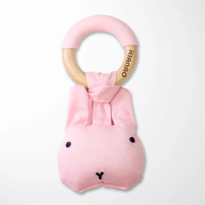 light pink plush monster rattle teething toy with wooden ring, organic cotton baby teether in soft pink color