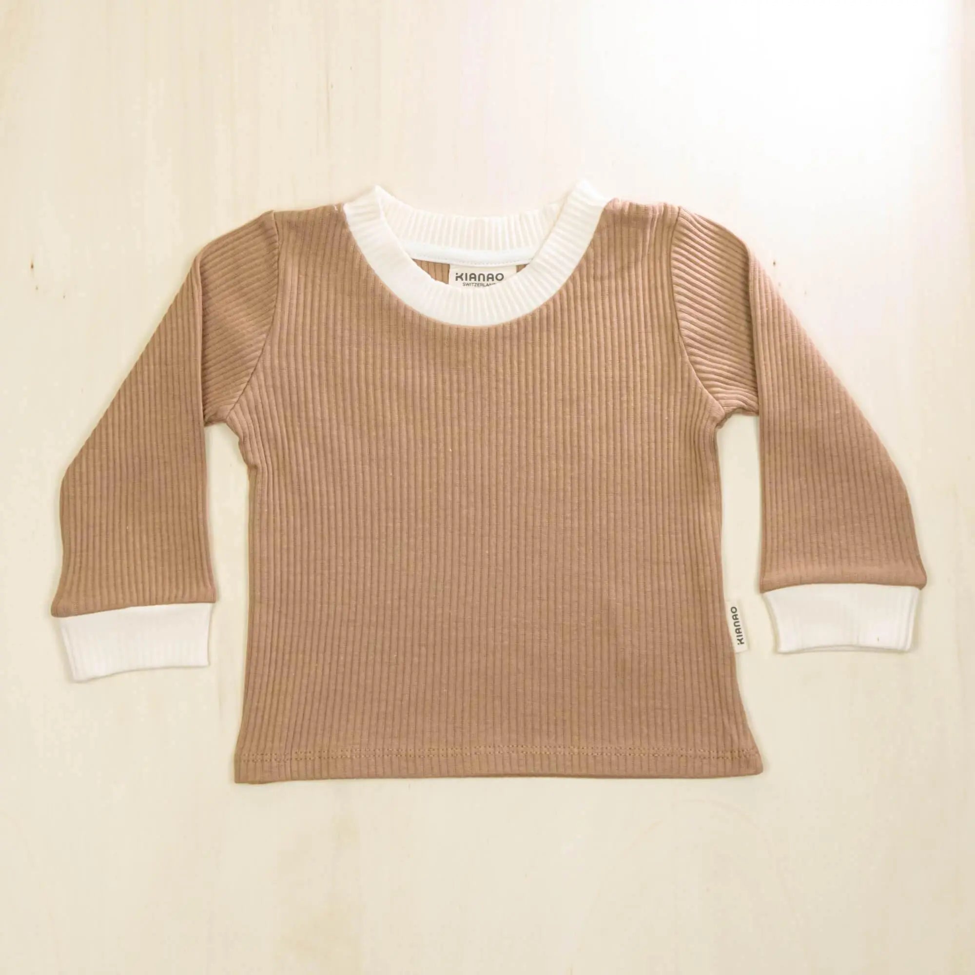 mocha organic cotton baby sweater with white contrast collar and cuffs, sustainably made with stretch for growing children