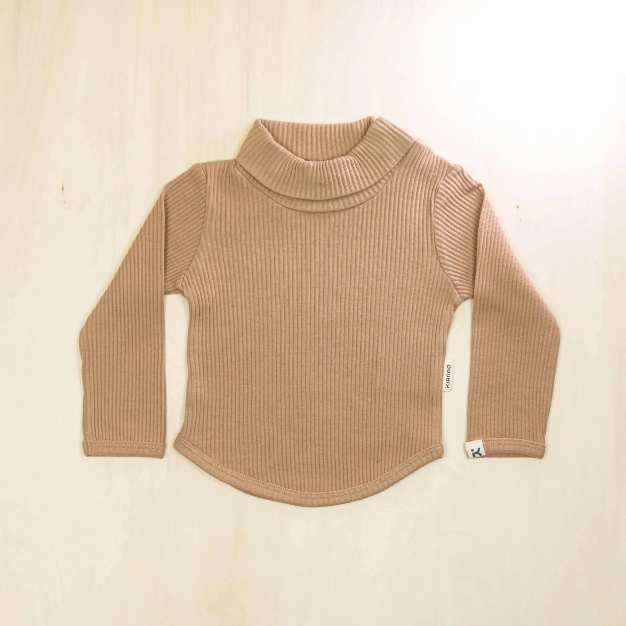 mocha organic cotton baby turtleneck sweater with long sleeves and rounded hemline, soft stretch fabric perfect for growing children