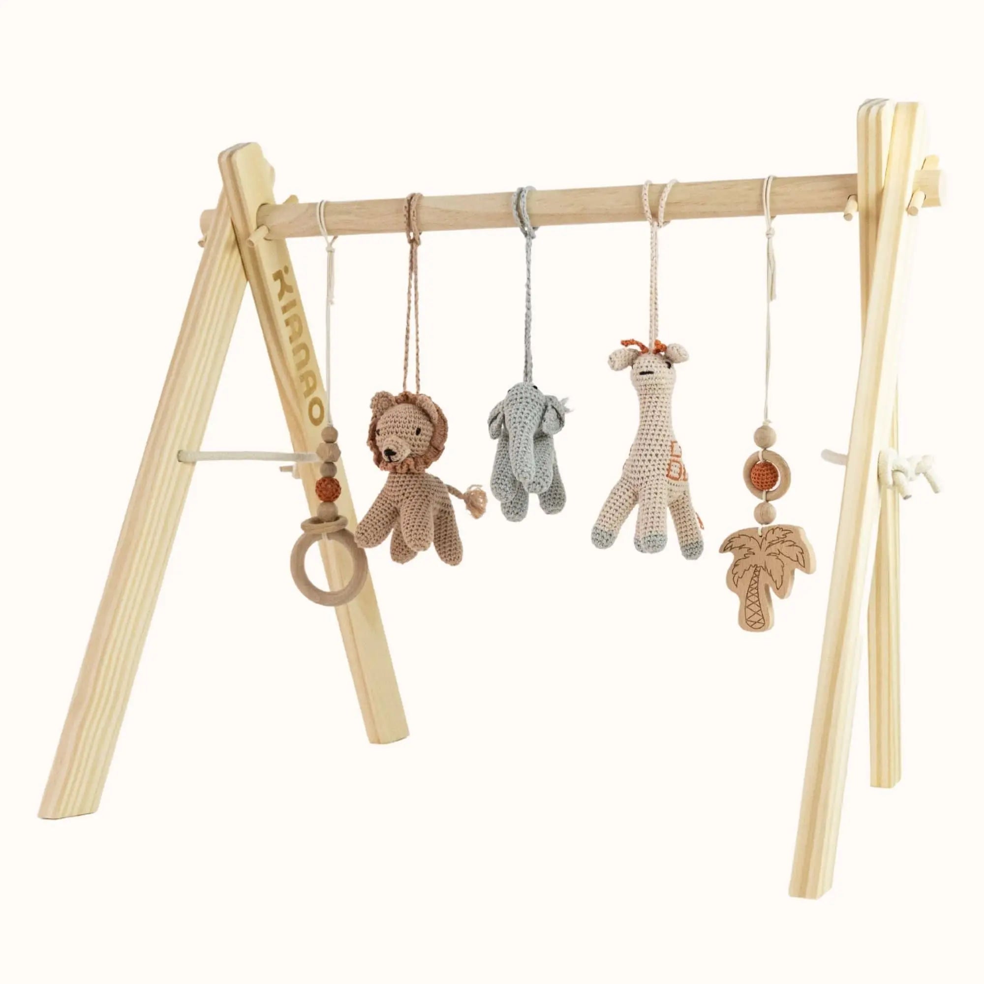 Natural wooden baby gym with crocheted safari animals including lion, elephant, and giraffe hanging from sturdy A-frame