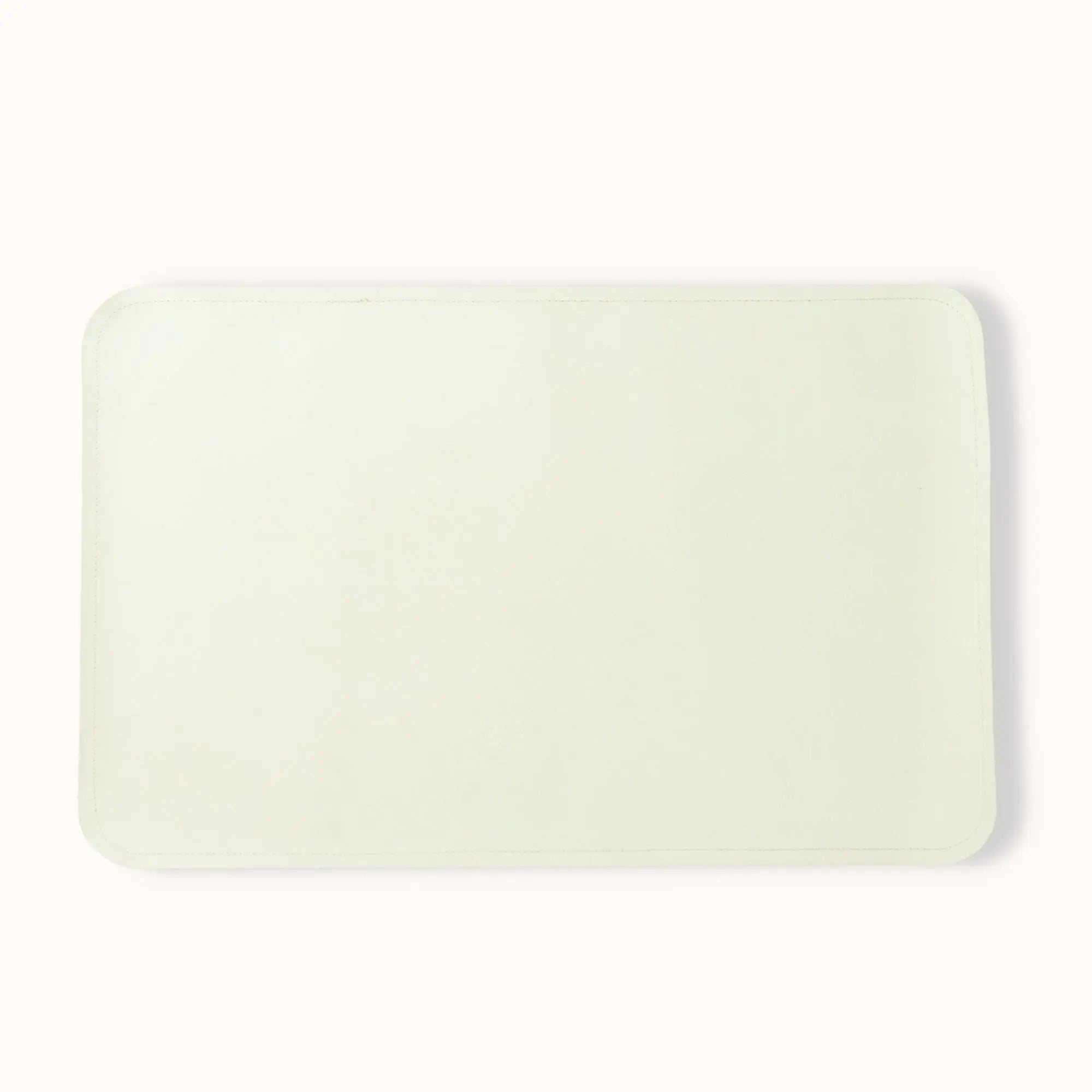 folded oat cream baby changing mat demonstrating compact portable design for travel