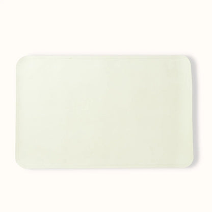 folded oat cream baby changing mat demonstrating compact portable design for travel