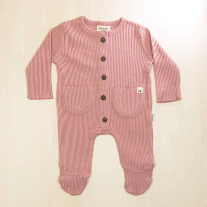 old rose organic cotton baby romper with integrated feet, front buttons and twin pockets, soft sustainable fabric for sensitive skin
