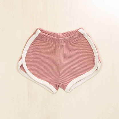 blossom white organic cotton baby shorts with contrasting trim, soft ribbed texture gentle on sensitive skin