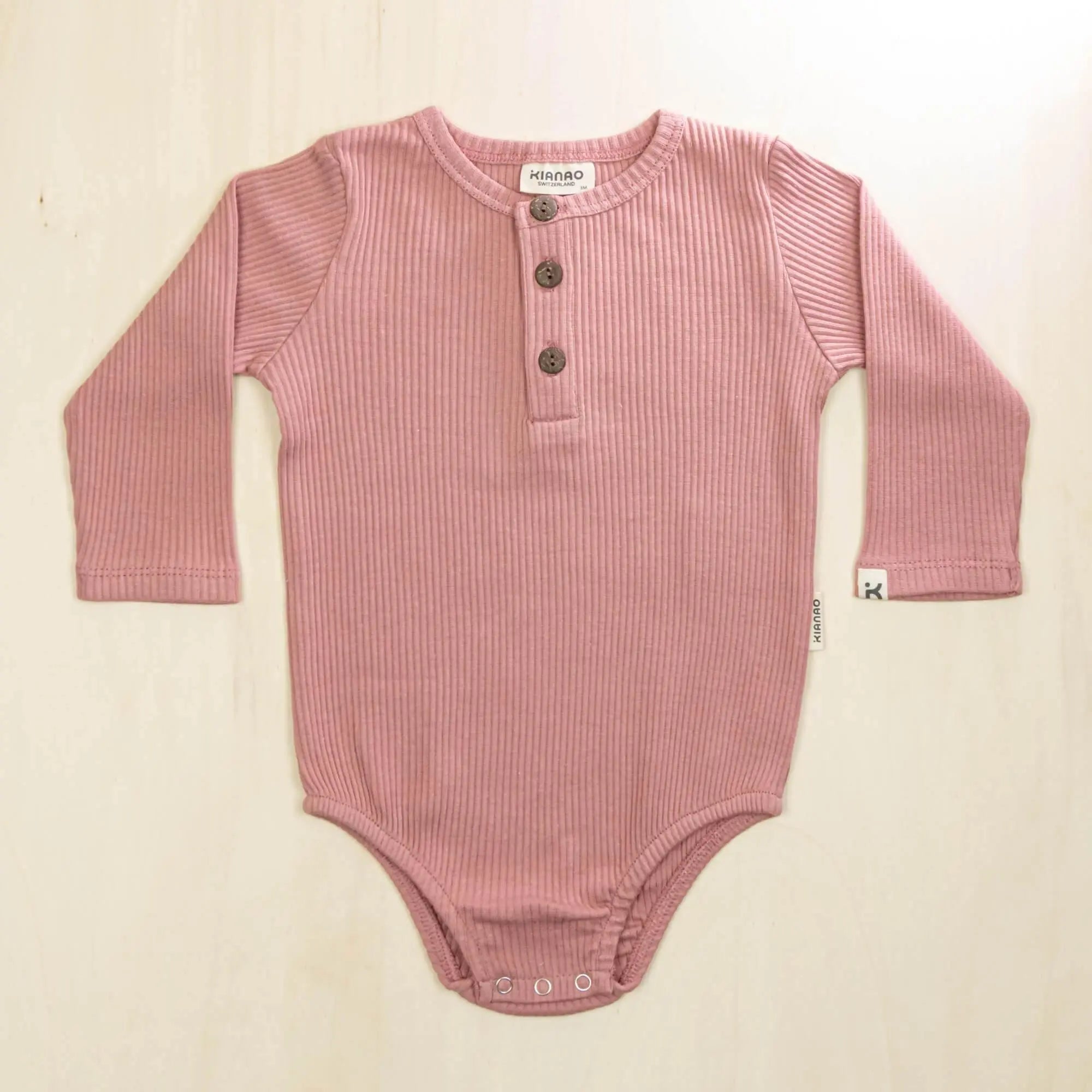 old rose organic cotton baby romper with henley button front and long sleeves for winter warmth