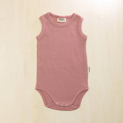 old rose organic cotton baby bodysuit with flat seams and tagless design to prevent skin irritation
