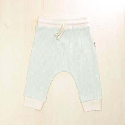 pale turquoise organic cotton baby pants with white trim, comfortable jogger style with adjustable drawstring waist