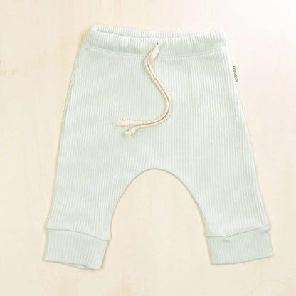 pale turquoise organic cotton baby pants with adjustable drawstring, ribbed texture and relaxed harem fit for comfort