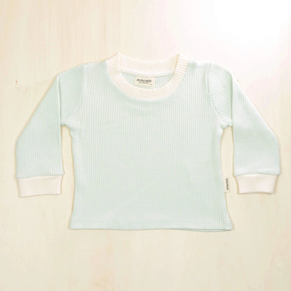pale turquoise organic cotton baby sweater with white trim detailing, retro design perfect for layering in all seasons