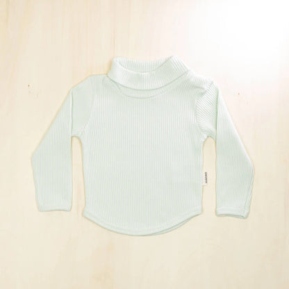 pale turquoise organic cotton baby turtleneck sweater with long sleeves and rounded hem, gentle fold-over neck design for warmth