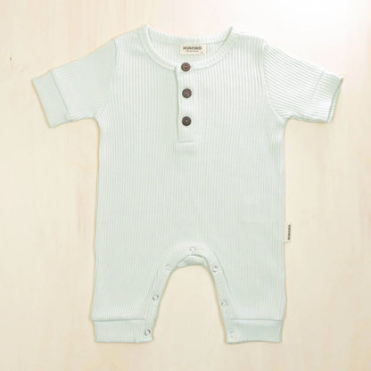 pale turquoise organic cotton henley romper with three-button placket perfect for quick outfit changes