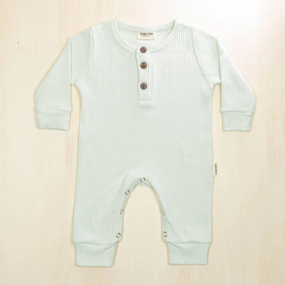 pale turquoise organic cotton romper with button neck design ideal for sleep and play