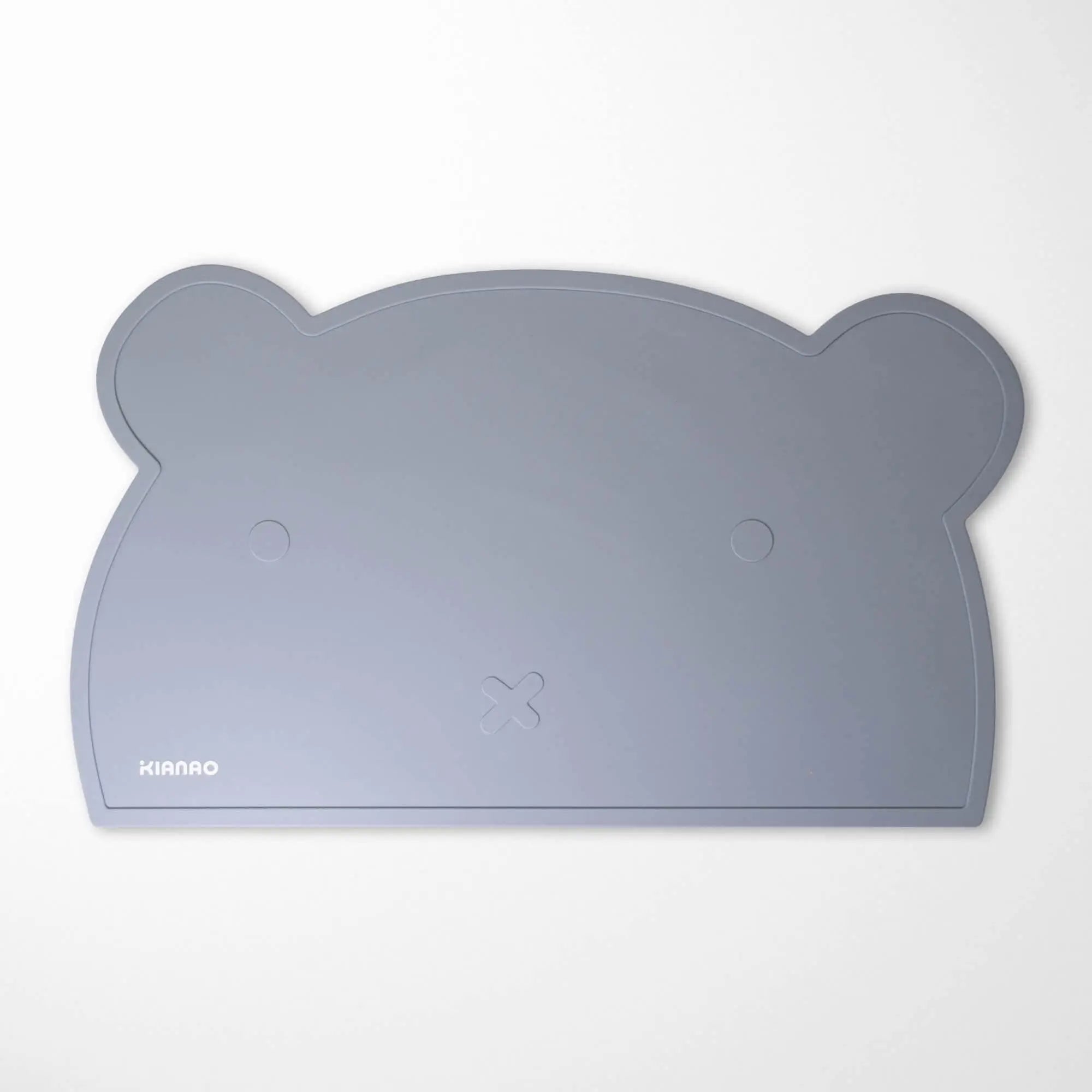 Back view of Pearl Beige bear silicone placemat demonstrating the tacky surface that grips tables without residue