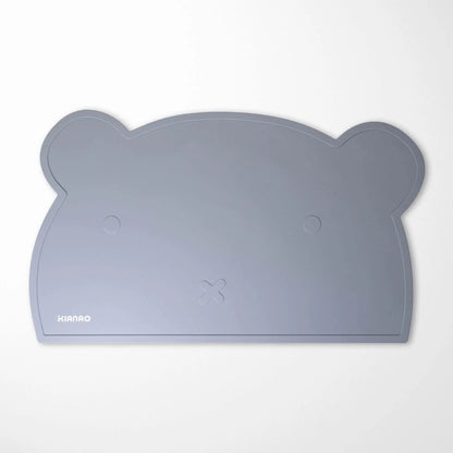 Back view of Pearl Beige bear silicone placemat demonstrating the tacky surface that grips tables without residue