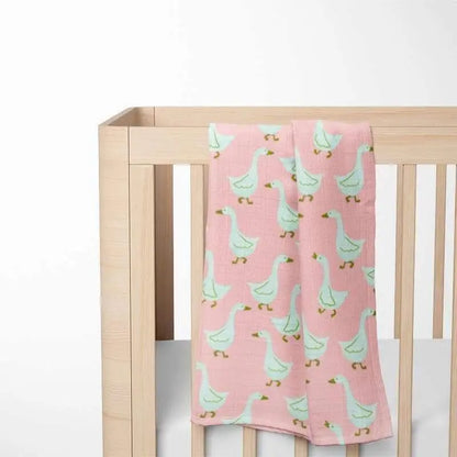 pink goose pattern baby blanket displayed in nursery crib showing size and softness perfect for toddler comfort