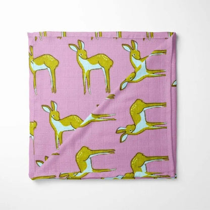 purple organic cotton baby blanket with green deer pattern double-layer design displayed flat showing woodland animal motif