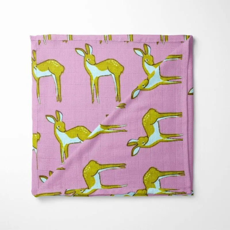 purple organic cotton baby blanket with green deer pattern double-layer design displayed flat showing woodland animal motif