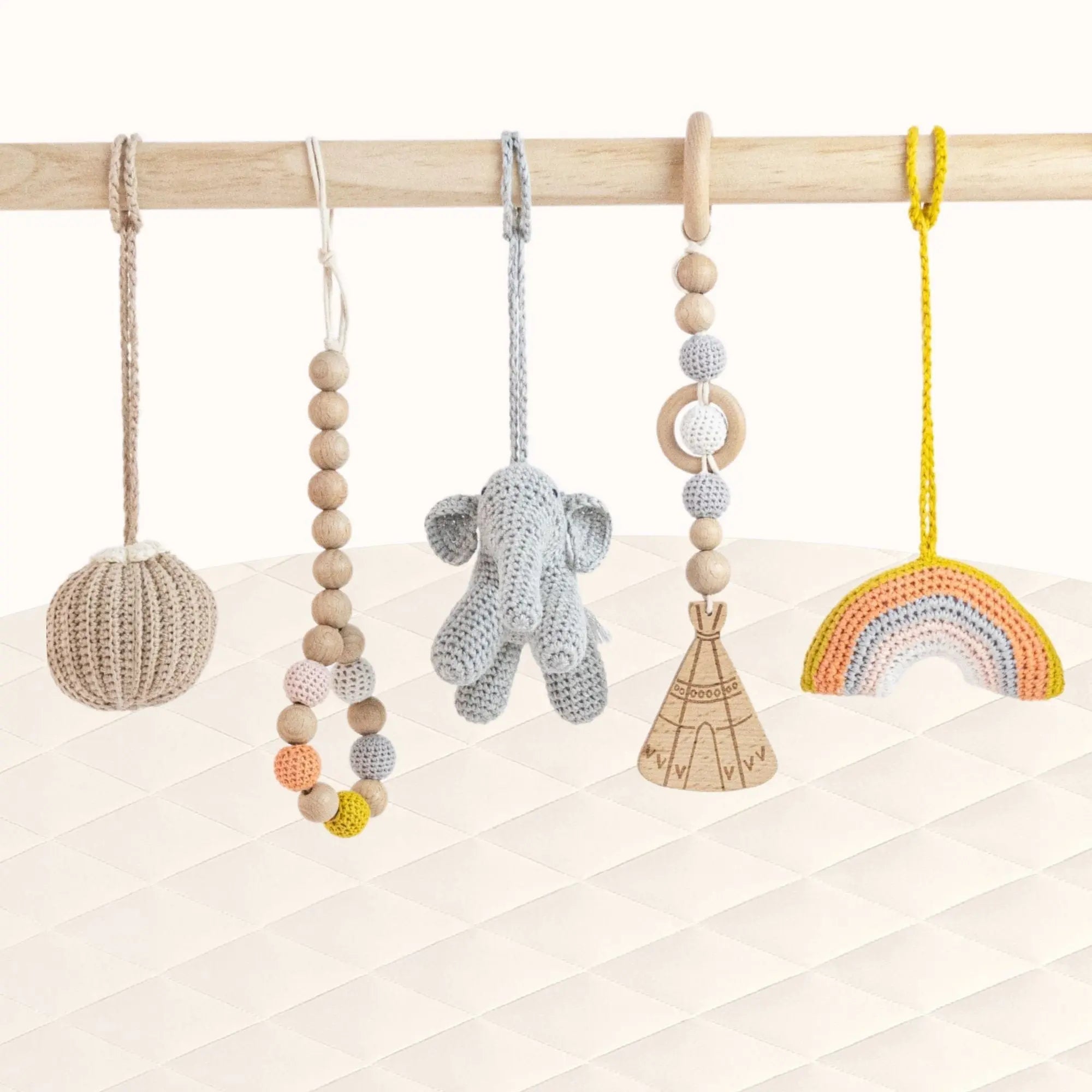 Front view of Rainbow Play Gym with elephant, ring and geometric toys perfectly positioned for baby's exploration