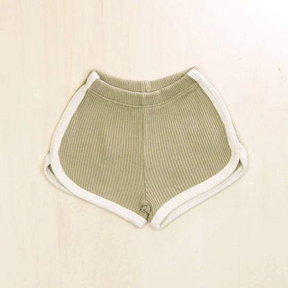 sage green organic cotton baby shorts with contrasting trim, retro athletic style with gentle elasticized waistband