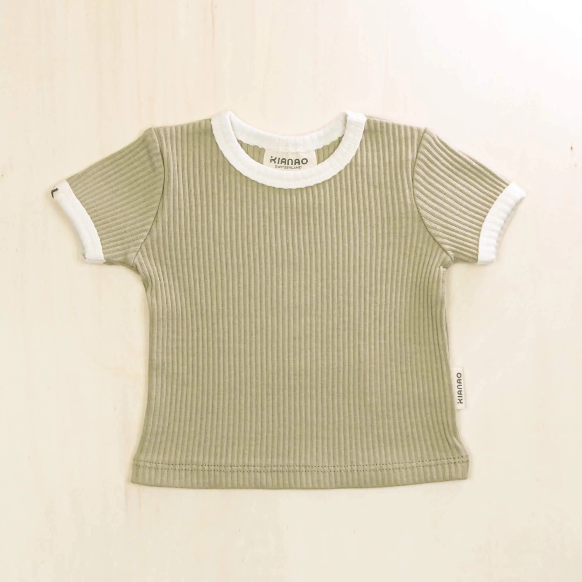 sage green organic cotton baby t-shirt featuring classic ringer design and stretchy ribbed fabric