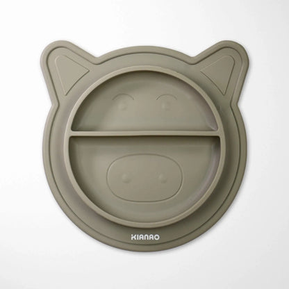 close-up of sage green silicone baby bowl with piglet ears and divided food sections, showing texture and flexibility