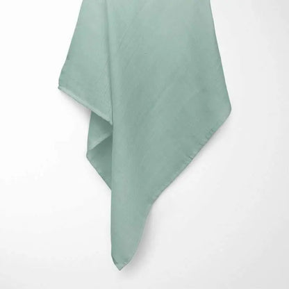 close-up of sage green bamboo baby blanket texture, showing the fine grid pattern and soft organic fibers