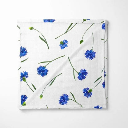 white bamboo baby blanket with blue cornflower pattern, organic and hypoallergenic for sensitive skin