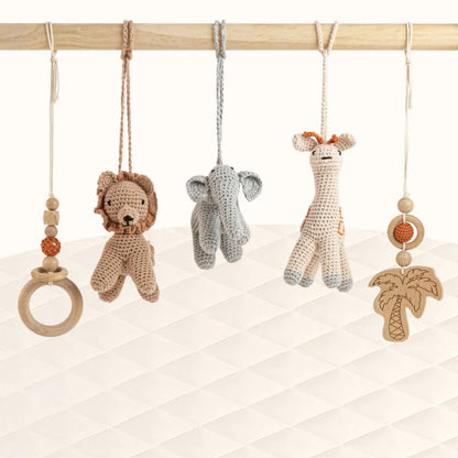 Front view of Wild Jungle Play Gym with all safari animal toys visible showing jungle-inspired theme