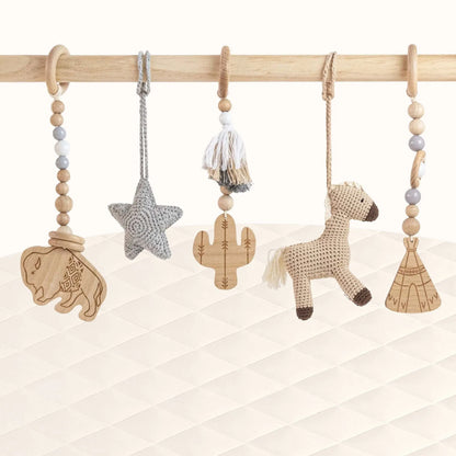 Front view of Wild Western Play Gym with all toys visible showcasing the American West theme