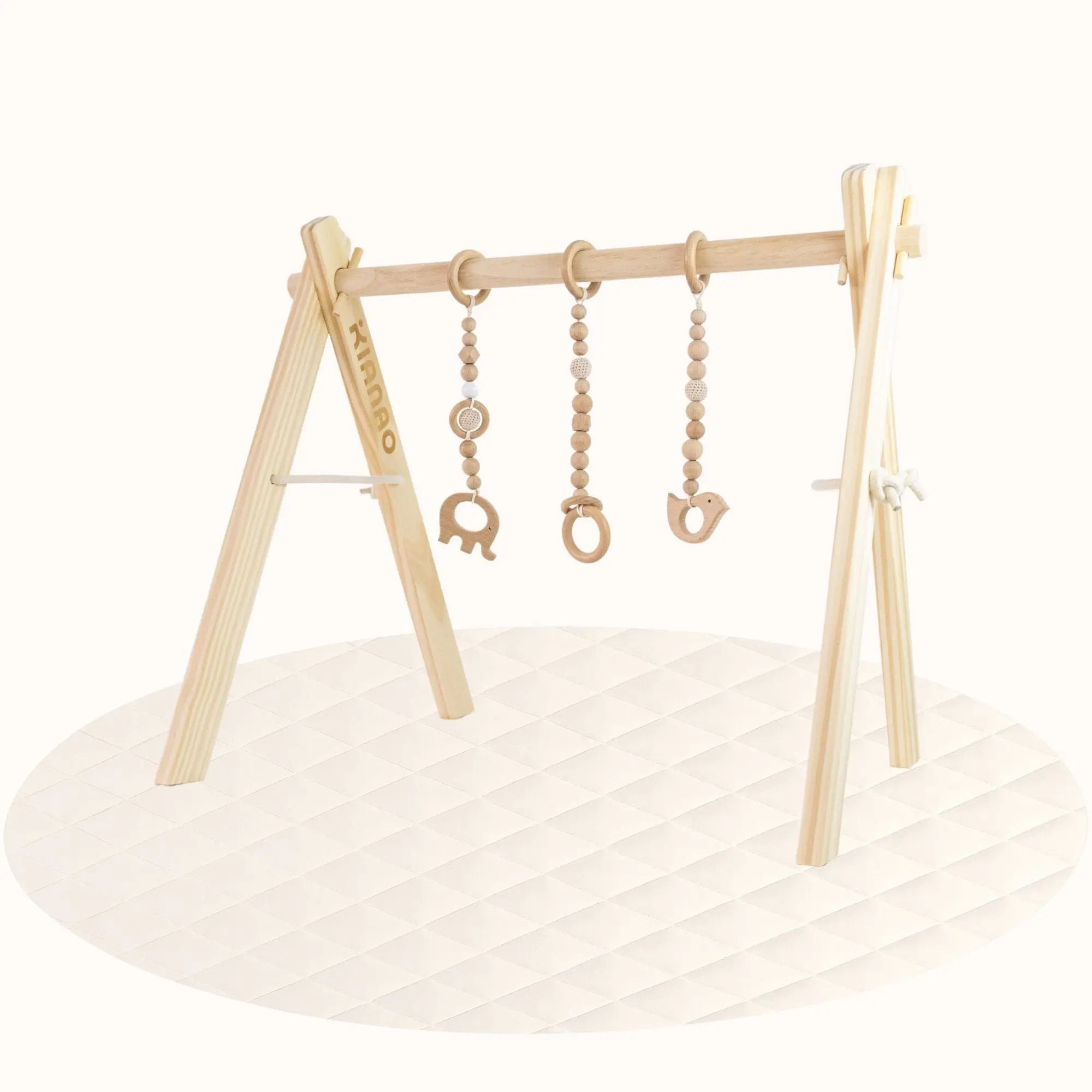 Side view of all-wood baby gym showing A-frame structure with hanging animal-shaped wooden toys
