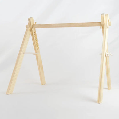 Front view of the complete wooden A-frame showing the perfect proportions for baby's play space