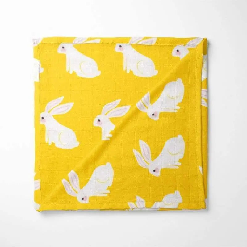 yellow organic cotton baby blanket with white bunny print pattern featuring double-layered fabric for temperature regulation