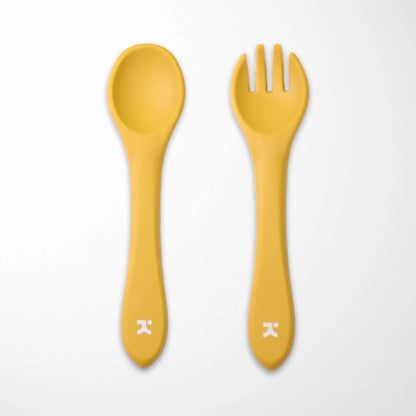 yellow silicone baby spoon and fork set designed for small hands with easy-grip handles